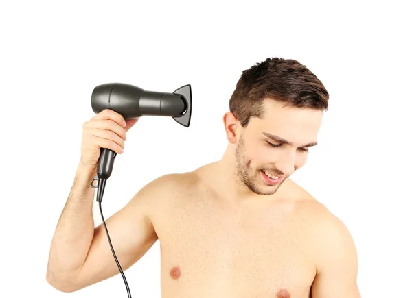 Beau jeune homme coup séchage ses cheveux isolés sur blanc — Photo