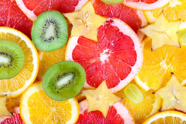 Fruits tranchés fond — Photo