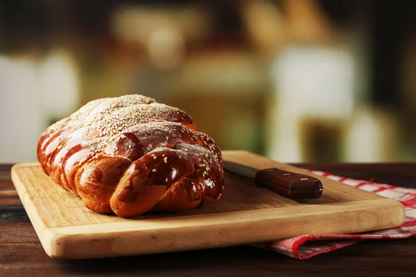 Fresh bun on table on bright background — Stock Photo, Image