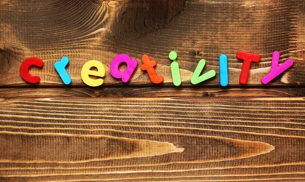 Word creativity on wooden background — Stock Photo, Image