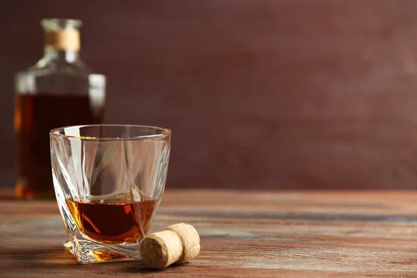 Whiskey on wooden background — Stock Photo, Image