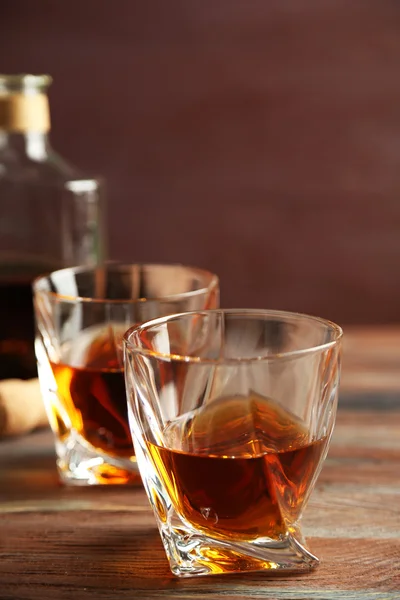 Whiskey on wooden background — Stock Photo, Image