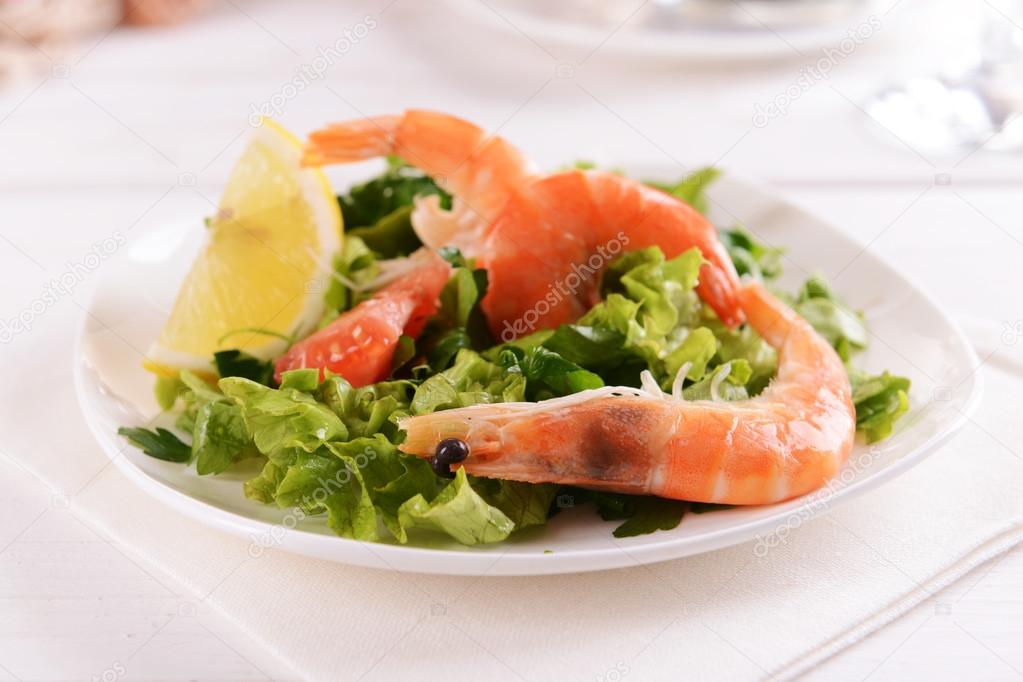 Tasty seafood on plate on table close-up