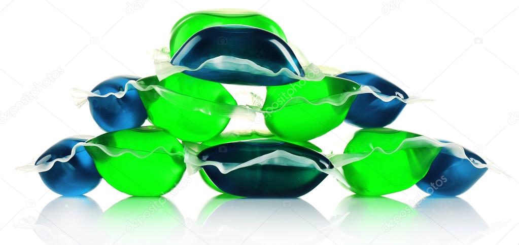 Gel capsules with laundry detergent isolated on white