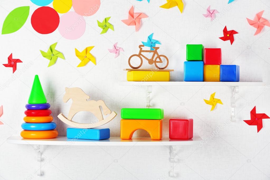 Shelves with toys in child room close-up