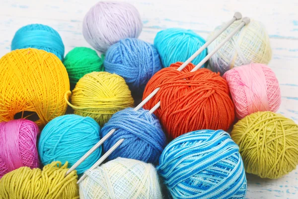 Yarns for knitting on wooden table close-up — Stock Photo, Image