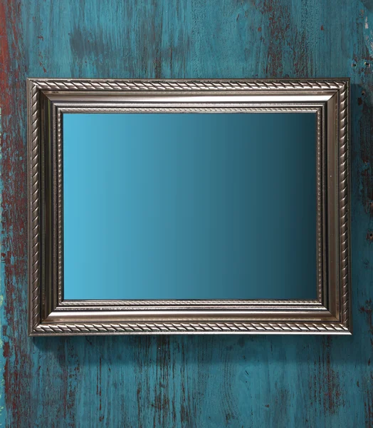 Vintage photo frame on color wooden background — Stock Photo, Image