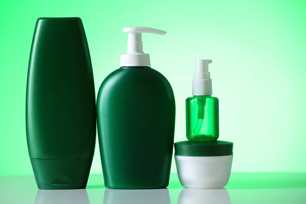 Cosmetic bottles on bright background — Stock Photo, Image