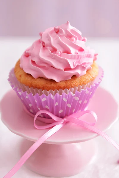 Sweet cupcake on table on light background — Stock Photo, Image