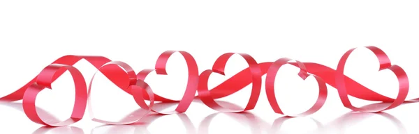 Red ribbons in shape of hearts isolated on white — Stock Photo, Image