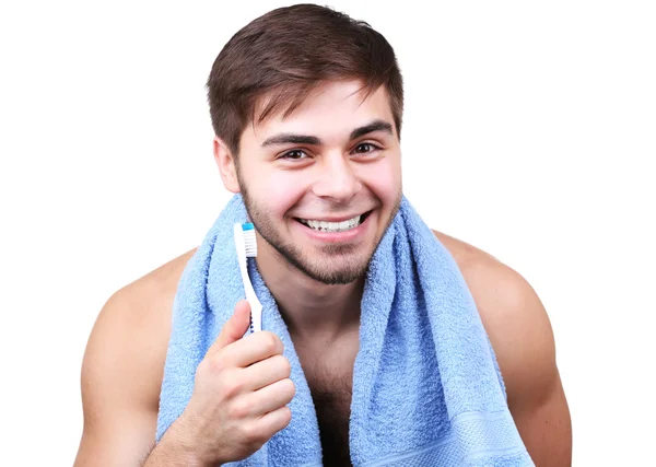 Retrato de joven con cepillo de dientes en mano aislado en blanco — Foto de Stock