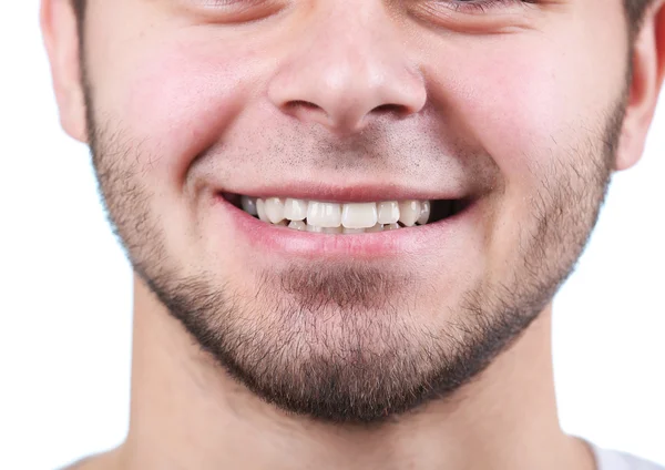 Sorrindo jovem após visita dentista em fundo embaçado brilhante — Fotografia de Stock