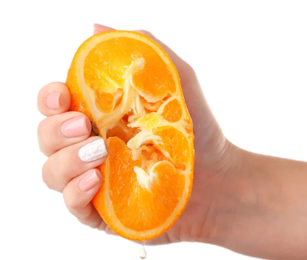 Жіноча рука стискає апельсин ізольовано на білому — стокове фото