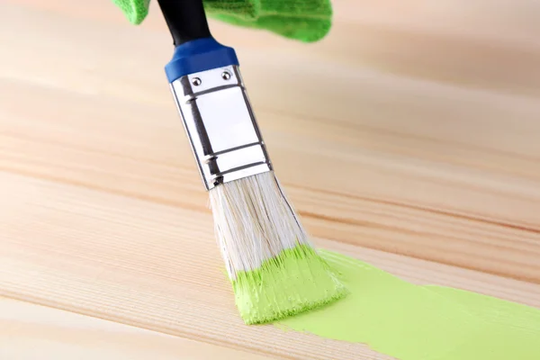 Brush painting wooden furniture, close up — Stock Photo, Image