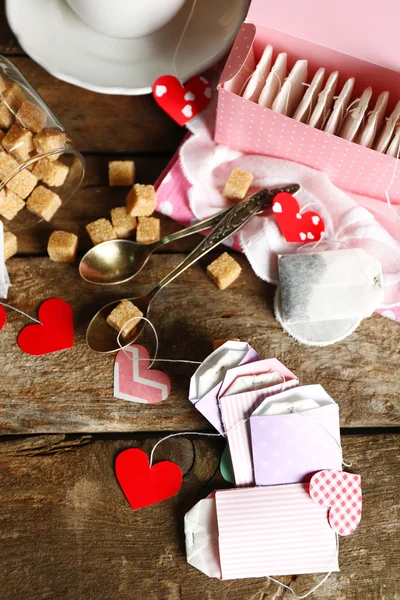 Heart shaped teabag tags and box on wooden background — Stock Photo, Image