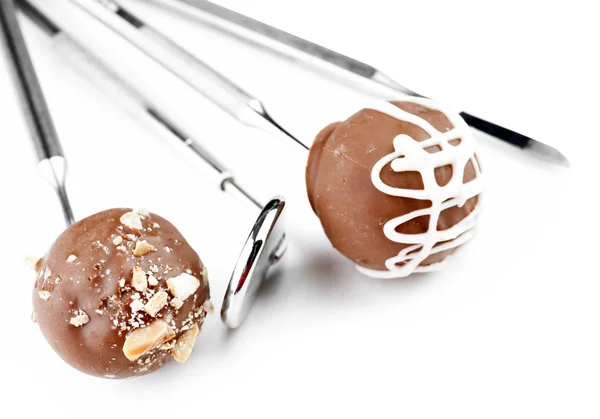 Zahnarzt-Werkzeuge mit Süßigkeiten isoliert auf weiß — Stockfoto
