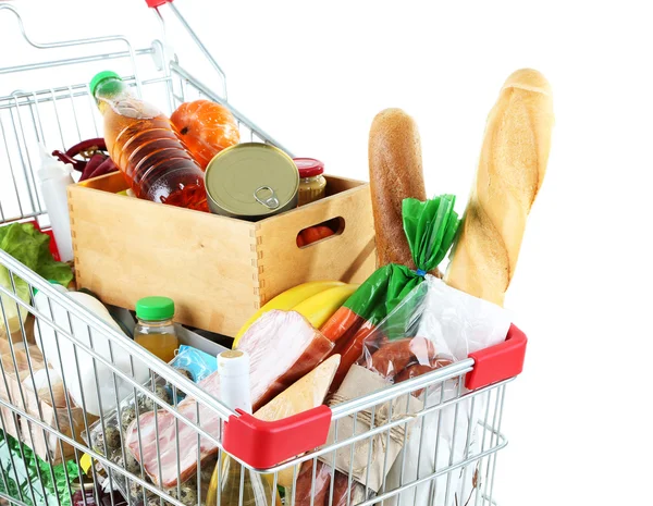 Winkelwagen vol met verschillende boodschappen geïsoleerd op wit — Stockfoto