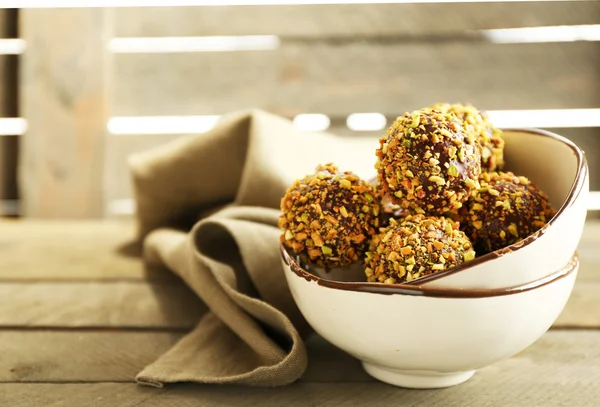 Tasty homemade pistachio candies on wooden table — Stock Photo, Image