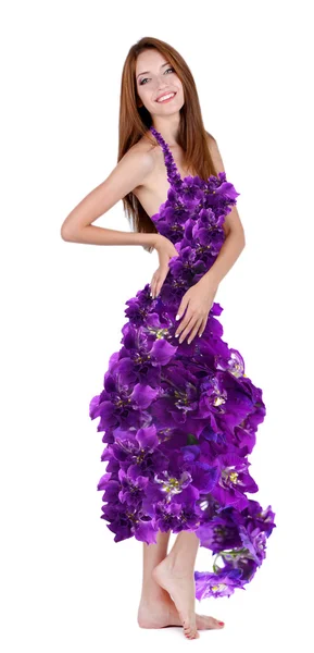 Beautiful young woman in dress made of flowers and flower petals isolated on white — Stock Photo, Image