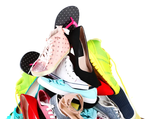 堆上白色孤立的各种女性球鞋 — 图库照片