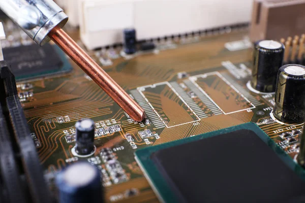 Repairing of computer motherboard, macro view — Stock Photo, Image