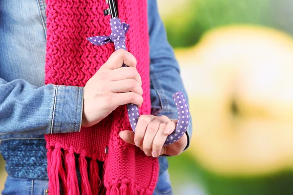 Girl with umbrella outdoors on natural background — Stock Photo, Image