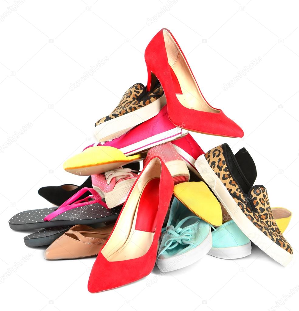 Pile of various female shoes isolated on white Stock Photo by ©belchonock  65646783