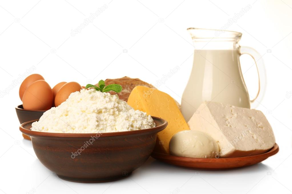 Dairy products in pottery,eggs and glass jug of milk isolated on white