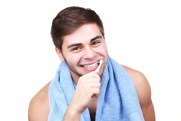Retrato de joven con cepillo de dientes en mano aislado en blanco — Foto de Stock