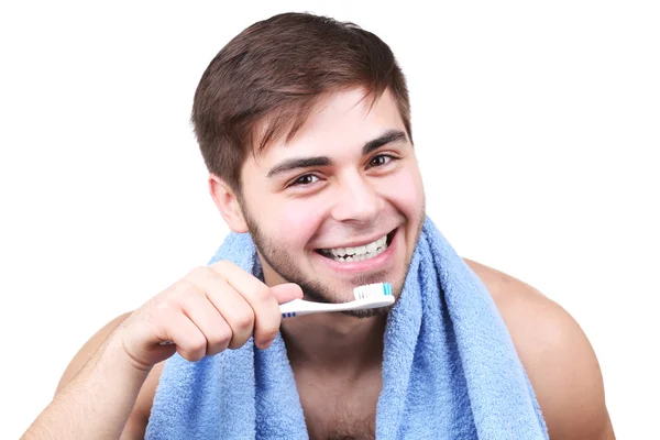 Retrato de jovem com escova de dentes na mão isolado em branco — Fotografia de Stock