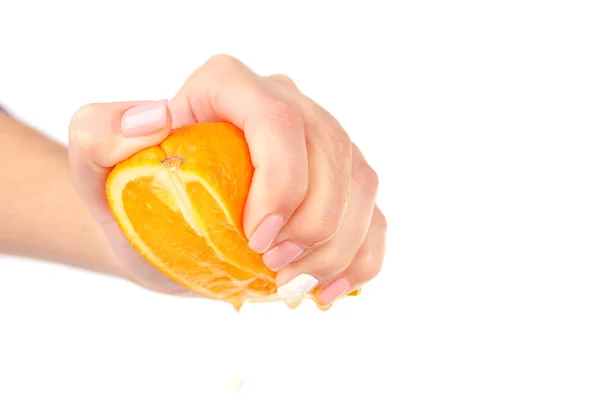 Female hand squeezing orange isolated on white — Stock Photo, Image