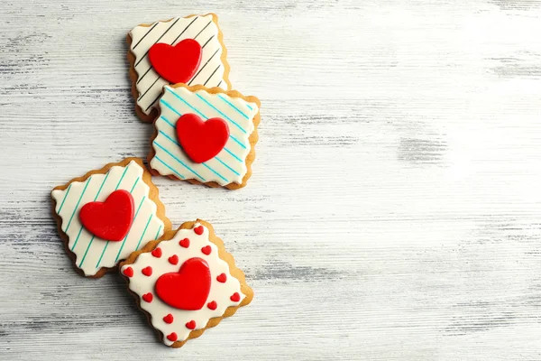 Heart shaped cookies for valentines day on color wooden background — Stock Photo, Image