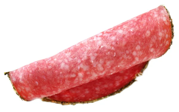 Rebanada de salami aislada sobre fondo blanco — Foto de Stock