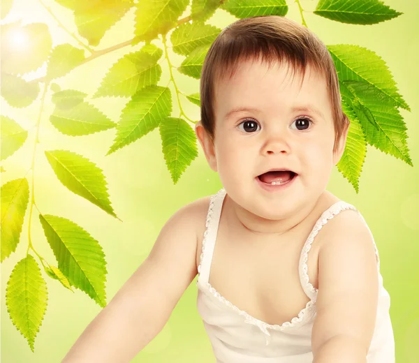 Cute baby girl on natural background — Stock Photo, Image