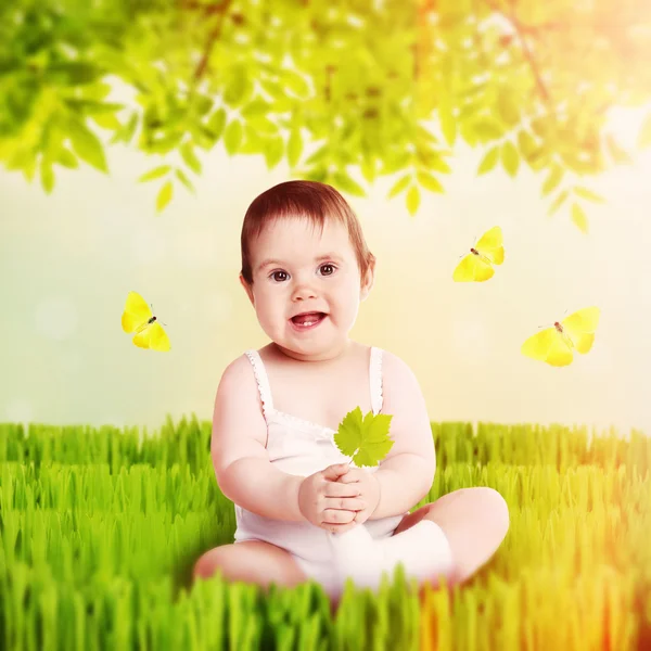 Cute baby girl on natural background — Stock Photo, Image