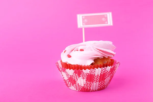 Delicious cupcake with inscription on color background — Stock Photo, Image