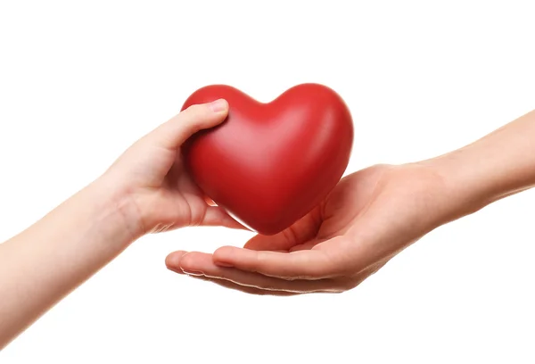 Heart in child and mother hands isolated on white — Stock Photo, Image