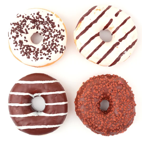 Heerlijke donuts met suikerglazuur geïsoleerd op wit — Stockfoto