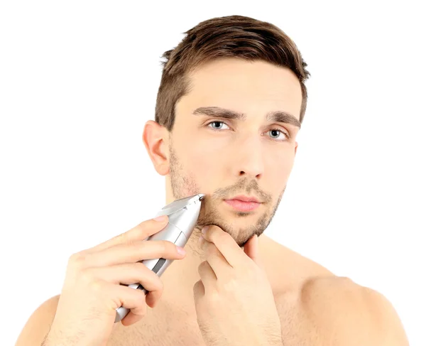 Handsome young man shaving his beard isolated on white — Stock Photo, Image