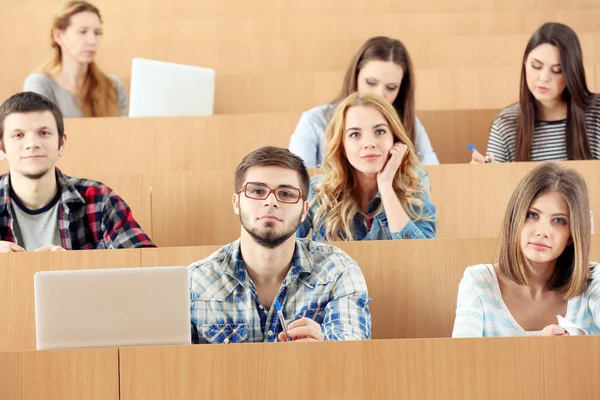 Group of students sitting in classroom — Stock Photo, Image