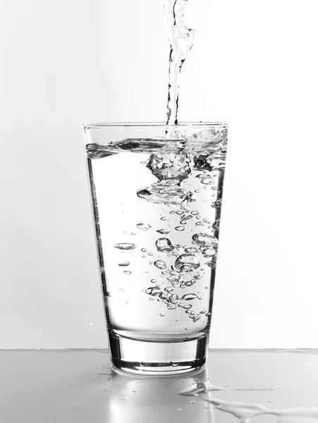 Water pouring in glass — Stock Photo, Image