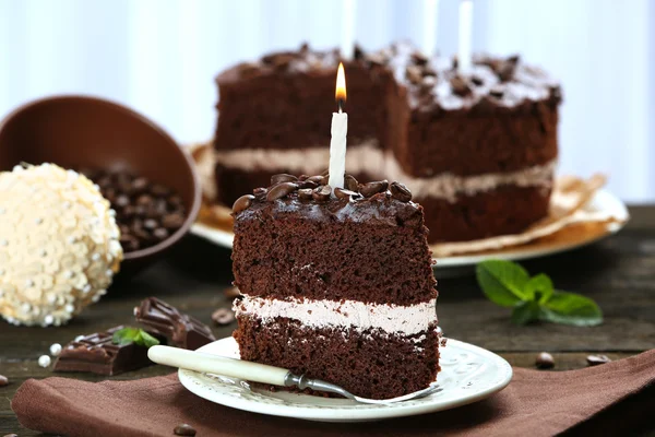 Delicious chocolate cake on table on light background — Stock Photo, Image