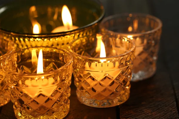 Burning candles in glass candlesticks close-up — Stock Photo, Image