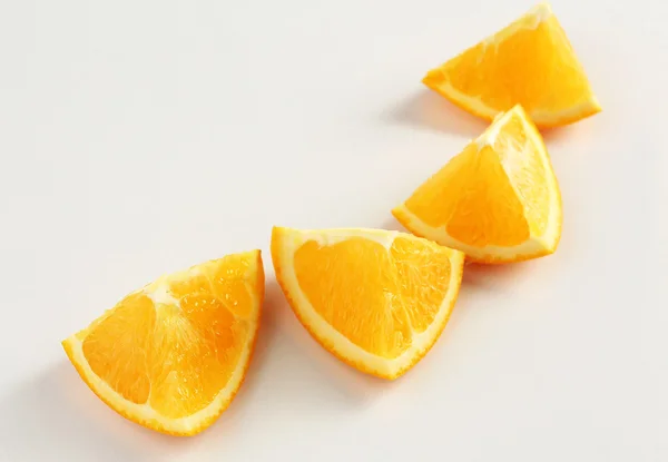 Juicy slices of orange isolated on white — Stock Photo, Image