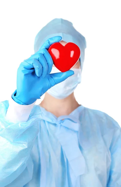 Декоративное сердце в руках врачей, изолированное на белом — стоковое фото