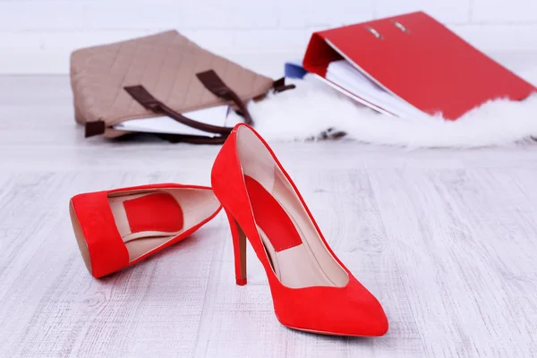 Female shoes and briefcase on floor background — Stock Photo, Image