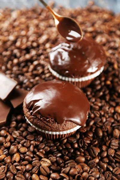 Composition with tasty homemade chocolate muffins and coffee beans — Stock Photo, Image