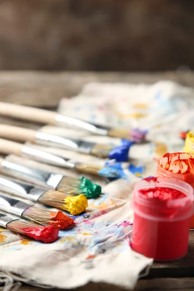 Brushes with colorful paints — Stock Photo, Image