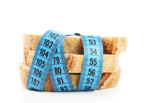 Fresh bread with measuring tape — Stock Photo, Image