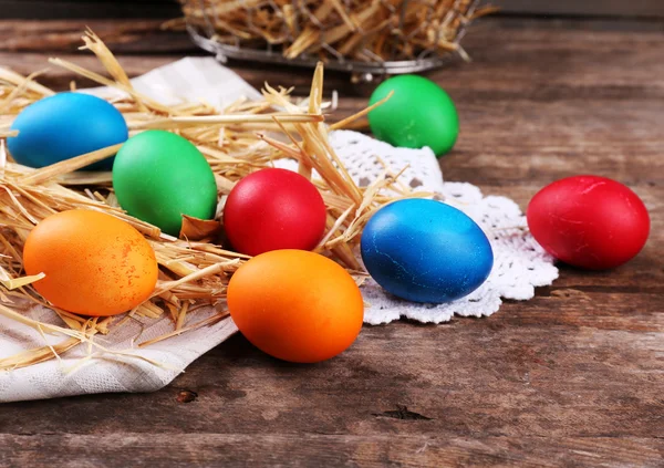 Easter eggs on tray with straw — Stock Photo, Image